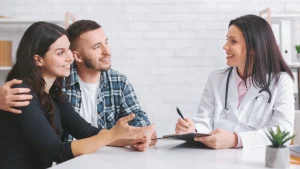 Couple discussing IVF success factors with a fertility specialist in Louisville, Kentucky