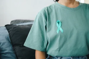 Woman with PCOS Awareness ribbon for the PCOS Awareness Month in September